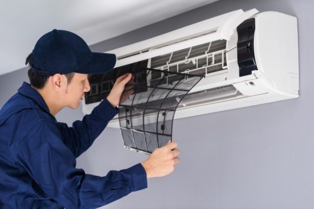 technician-service-removing-air-filter-air-conditioner-cleaning_35076-3617-640x426
